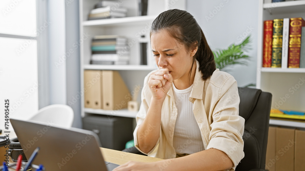Coughing attack hits beautiful young hispanic woman while working hard at her office job amid coronavirus concerns Coughing attack hits beautiful young hispanic woman while working hard at her office job amid coronavirus concerns