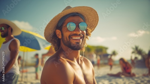 a happy attractive young man with sunglasses enjoying himself on a sunny beach during a warm day. Man on the beach in the summer. travelling alone concept, happy moment. 