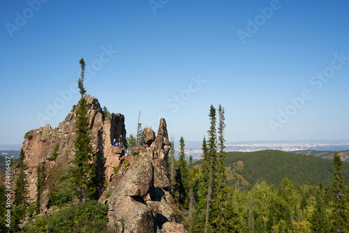 Recreation site for tourists to relax and training of rock climbers and mountaineers. Krasnoyarsk Stolby National Park, Siberia Russia. point of scenic interest Kitayskaya Stenka. Autumn nature  photo