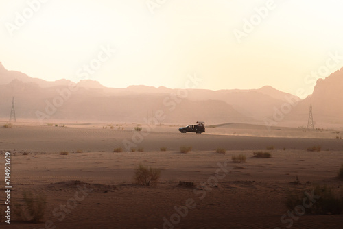 Car in the middle of the desert of Wadi Rum