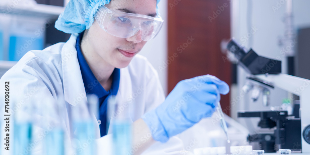 Professional scientist chemist technician analysis research experiment virus blue liquid pipette glass test tube equipment in hospital laboratory, woman doctor white lab coat medical research develop - obrazy, fototapety, plakaty 