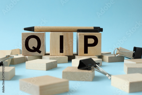 Wallpaper Mural QIP blue background. text on wooden blocks Torontodigital.ca