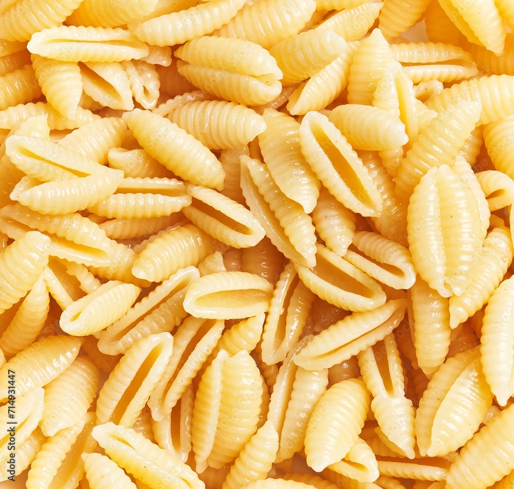 Close-up of uncooked italian fusilli pasta forming a textured background, suitable for culinary themes. Close-up of uncooked italian fusilli pasta forming a textured background, suitable for culinary themes.
