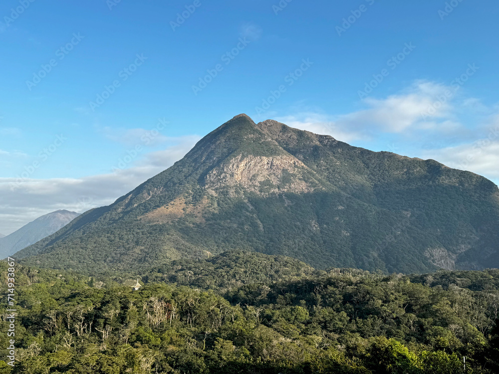 Obraz premium Breathtaking view of Ngong Ping highlands in Hong Kong. Seen is the mountain and hills,Picture is taken from the Giant Buddha or Tian Tian Buddha monastery. Gives a fresh jungle and country side feel