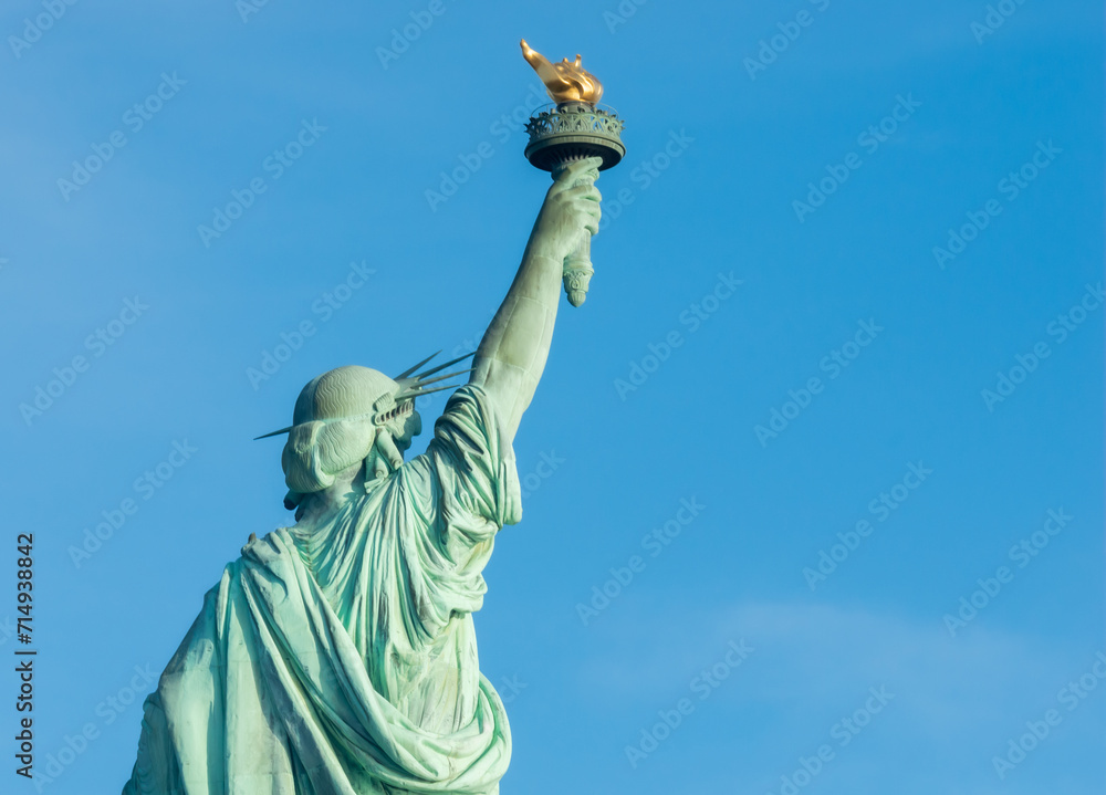 Fototapeta premium Statue of Liberty against blue sky in New York City