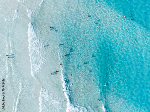 Aerial view on beach and people. Vacation and adventure. Europe, Mediterranean Sea. Top view from drone at beach and azure sea. View on the coast from drone.