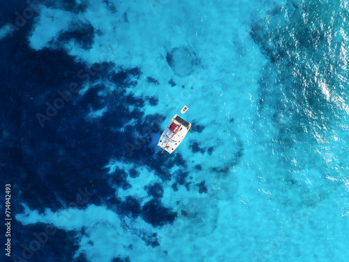 Drone view of a sailing yacht. Luxury transportation. Vacation and holidays. Summer time for sea travel. The sea bay. Photo for background and wallpaper.