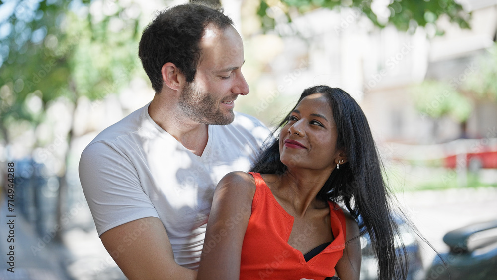 Beautiful couple smiling confident hugging each other at street Beautiful couple smiling confident hugging each other at street