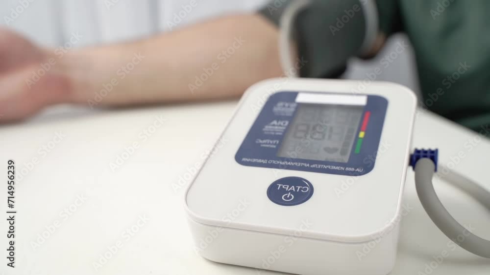 a man measures blood pressure with a tonometer a man measures blood pressure with a tonometer