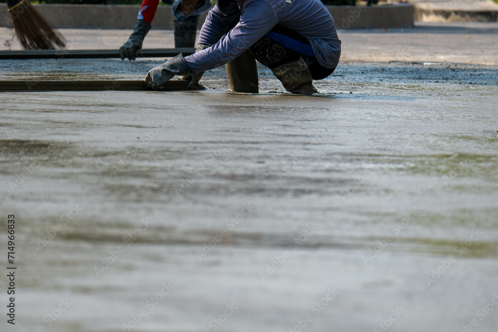 Cement mortar work. Construction trowel level tools. Asphalt road.
Cement mortar work. Construction trowel level tools. Asphalt road.