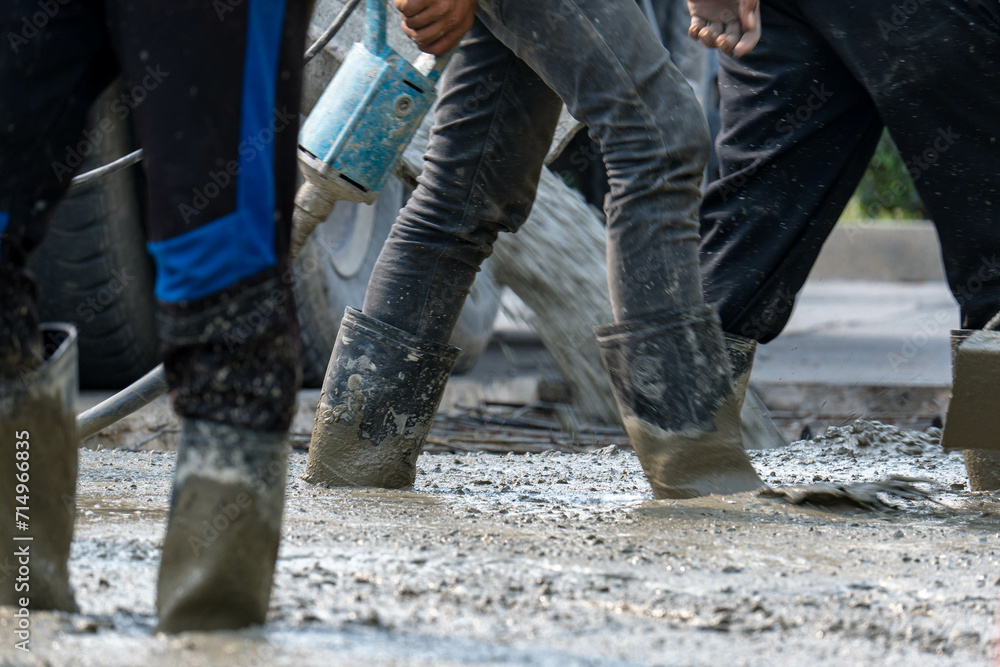 Cement mortar work. Construction trowel level tools. Asphalt road.
Cement mortar work. Construction trowel level tools. Asphalt road.