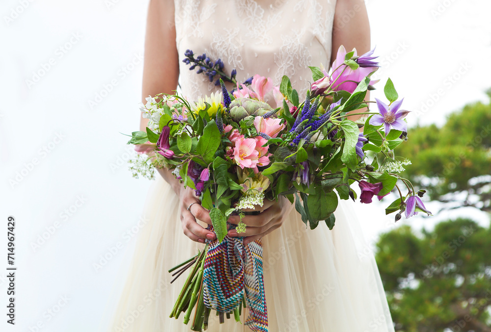 Beautiful bride outdoors in a forest.