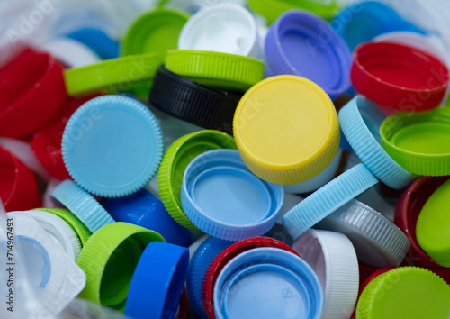Colourful of plastic caps made from polypropylene or PP grade that can recycle and environmentally friendly. spot focus.