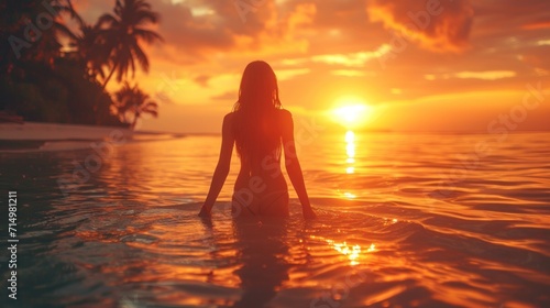 Silhouette of girl at beach dancing in water against sunrise background, beautiful sunrise color pallete, bokeh, palm trees © YamunaART