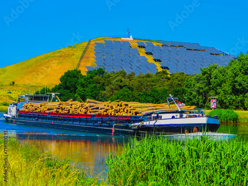 Frachtschiff mit Baumstämmen auf Main Donau Kanal photo