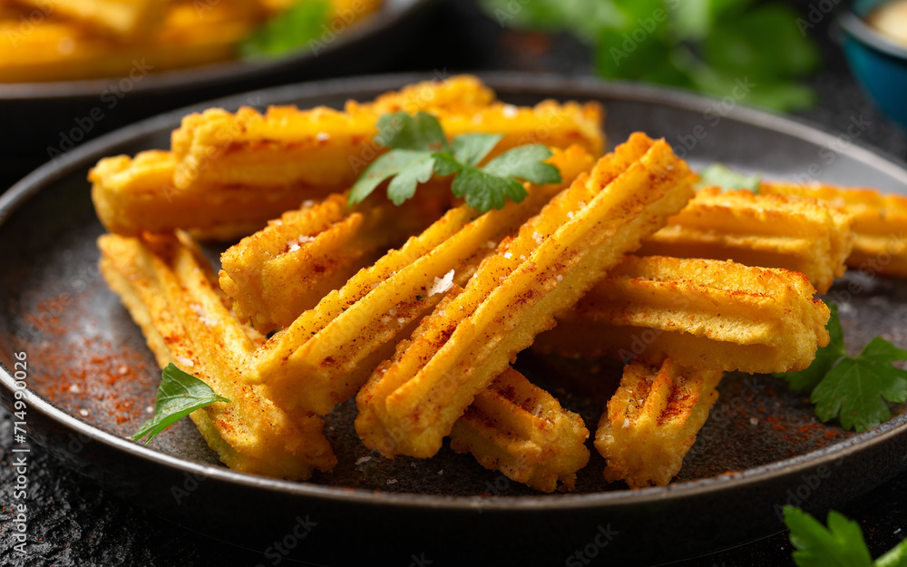 Crisp and golden Potato churros served with paprika and fresh parsley Crisp and golden Potato churros served with paprika and fresh parsley