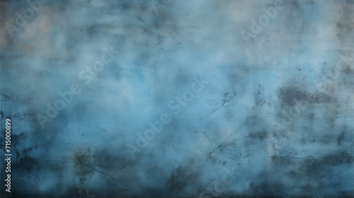 Texture of an old concrete wall painted blue with a black gradient along the edges. Abstract background design