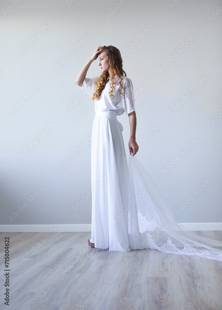 Young pretty blond woman wearing wedding dress