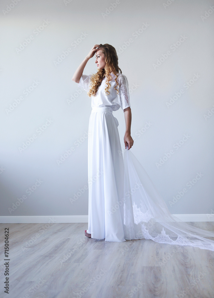 Young pretty blond woman wearing wedding dress Young pretty blond woman wearing wedding dress