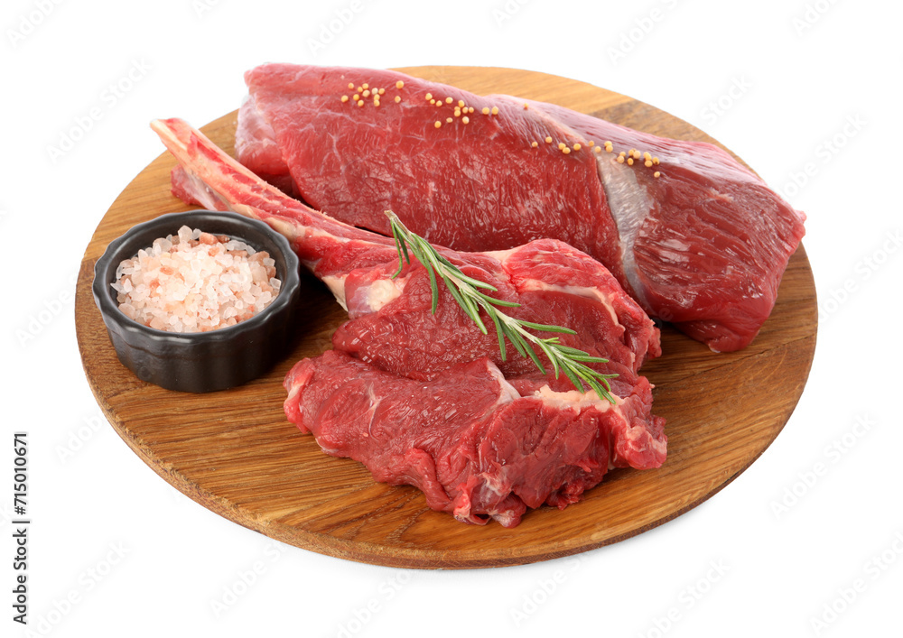 Pieces of raw beef meat and spices isolated on white