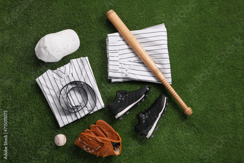 Photography Flat lay composition with baseball equipment on artificial grass