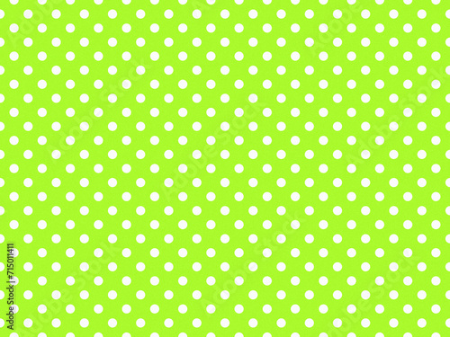 texturised white color polka dots over green yellow background