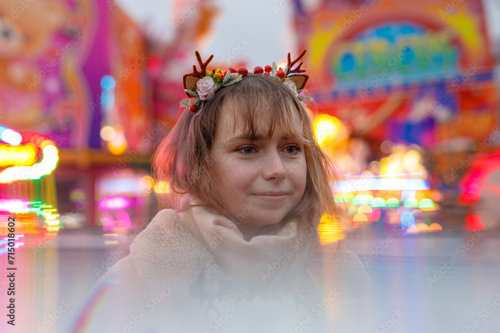 young cosplay woman on fun fare and Ferris wheel with magic winter lights young cosplay woman on fun fare and Ferris wheel with magic winter lights
