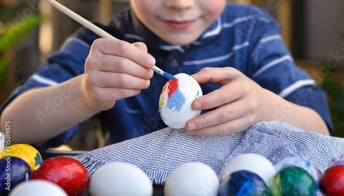 Child Painting Eggs - Painting Easter Eggs on the Day of Easter 