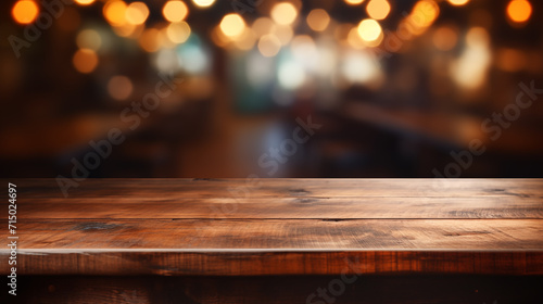 Empty wooden tabletop with bokeh lights on blurred bar background