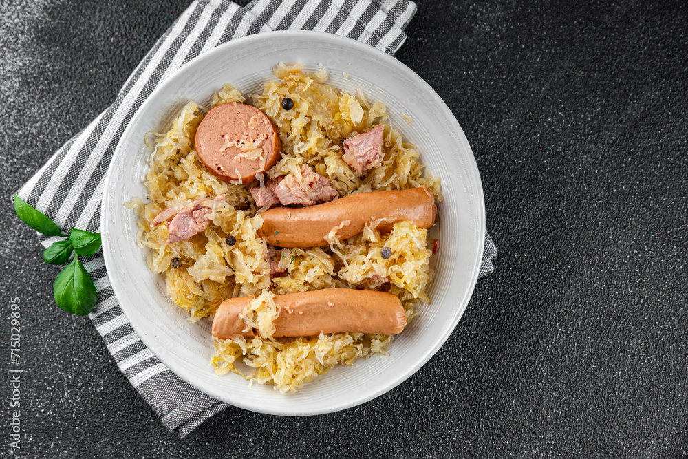 cabbage sauerkraut garnish meat, sausage tasty fresh eating cooking meal food snack on the table copy space food background rustic top view cabbage sauerkraut garnish meat, sausage tasty fresh eating cooking meal food snack on the table copy space food background rustic top view