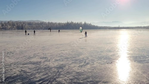 Ice skating on a frozen mountain lake in the Alps.