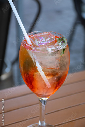 close up of drink glasses with ramazzotti rosato ice on a bistro table in the city center photo