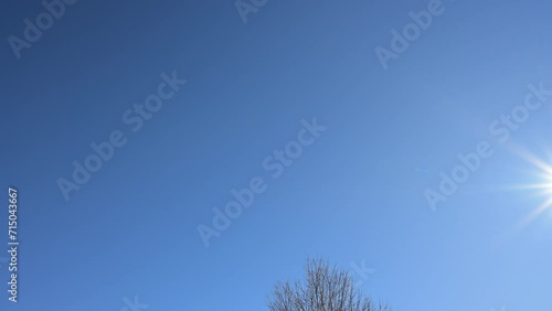 Beautiful blue sky background with light to moderate, background sounds and ambience from the afternoon, the scene of which occurs in the freezing cold of winter.