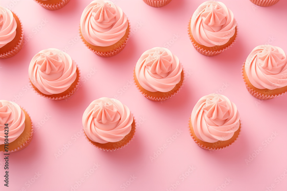 Flatlay with pink cupcakes on a pink background. Festive image for bakery's advertisement or children's birthday party service. Design for a cafe or dessert shop. Banner with copy space Flatlay with pink cupcakes on a pink background. Festive image for bakery's advertisement or children's birthday party service. Design for a cafe or dessert shop. Banner with copy space