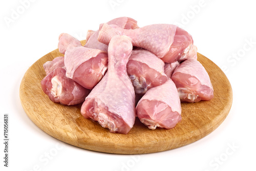 Raw chicken drumsticks, isolated on white background.