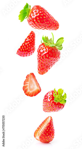 Whole and halved strawberries with vibrant red color and fresh green leaves, floating on a white background