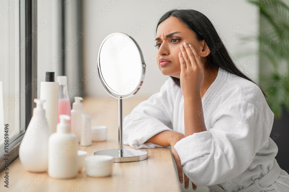 Indian Woman With Problem Skin Looking At Pimple On Cheek Indian Woman With Problem Skin Looking At Pimple On Cheek