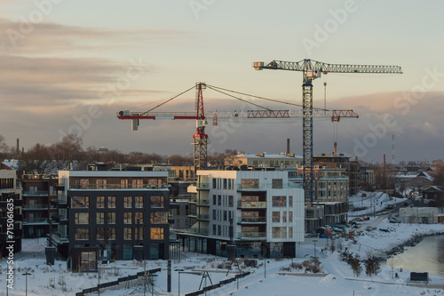 city area and construction cranes