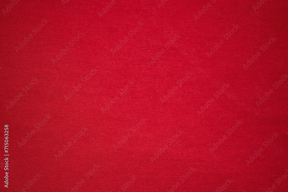 Knitted red background. Knitted knitted fabric is red. Red background - obrazy, fototapety, plakaty 