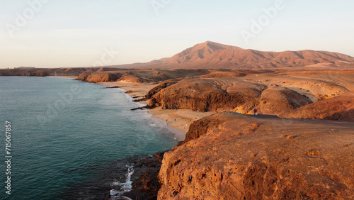 Coastline Atlantik Ocean view from above. Sunset above Mountain and Ocean. Canary Islands. Lanzarote 