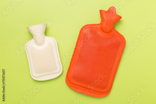 Rubber water warmer bags on color background