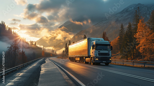 Commercial white truck on fall scenic highway, mountain vista, freight transport, sunrise journey, logistics, road trip, colorful autumn trees. © TEERAPONG