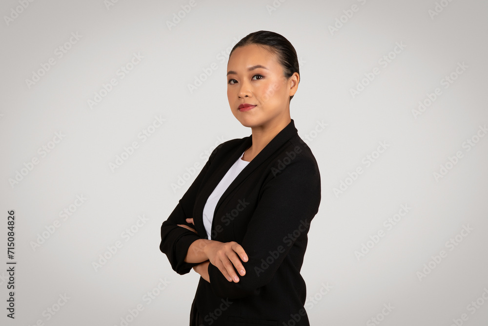 Confident Asian businesswoman in a smart black blazer Confident Asian businesswoman in a smart black blazer