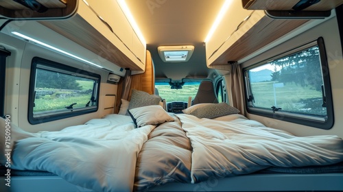 Modern camper van interior with a cozy interior and beautiful views of nature from the windows. Concept of mobile living, adventure travel, road trips, and nature-connected lifestyles.