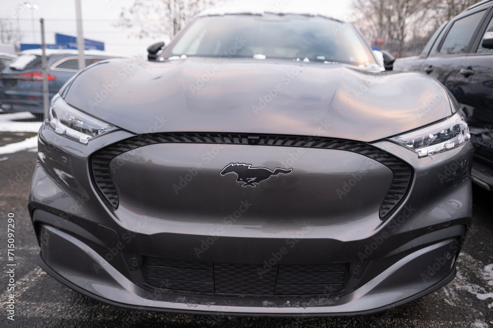electric car Ford Mustang Mach-E in winter parking lot, EV Europe
