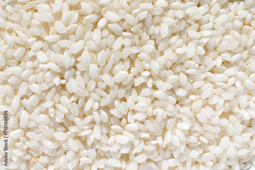 Uncooked organic white rice, background Uncooked organic white rice, background