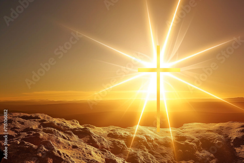 A cross rises on a mountain peak and the bright sun casts its warm light on the symbol. The light penetrates the surroundings and acts like a divine sign. photo