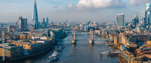 Aerial view of the Iconic Tower Bridge connecting Londong with Southwark on the Thames River in London, UK. © Aerial Film Studio