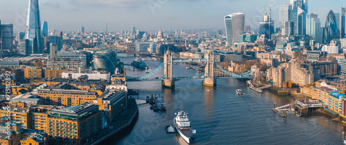 Aerial view of the Iconic Tower Bridge connecting Londong with Southwark on the Thames River in London, UK.