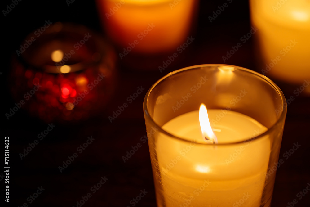 Burning Aromatic Candles in Glass on Dark Background, Close-up Burning Aromatic Candles in Glass on Dark Background, Close-up